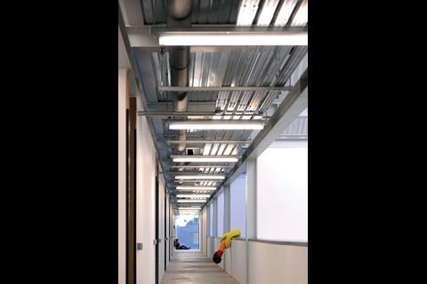 The first-floor corridor of the painting studios with balconies overlooking studios to the right.